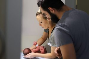 Mercy Hospital for Women midwife Courtney with dad Mahmut and baby Dilhan