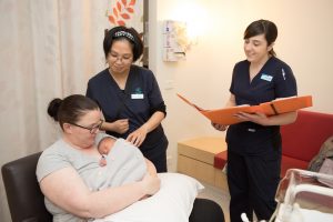 Werribee Mercy Hospital Special Care Nursery midwives  Jenny (L) and Claire (R) with mum Danielle and baby Flynn