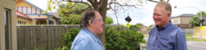 Mercy Palliative Care volunteer Brian Young (right) with patient Allan Howlett (left) at Allan’s home in Werribee.